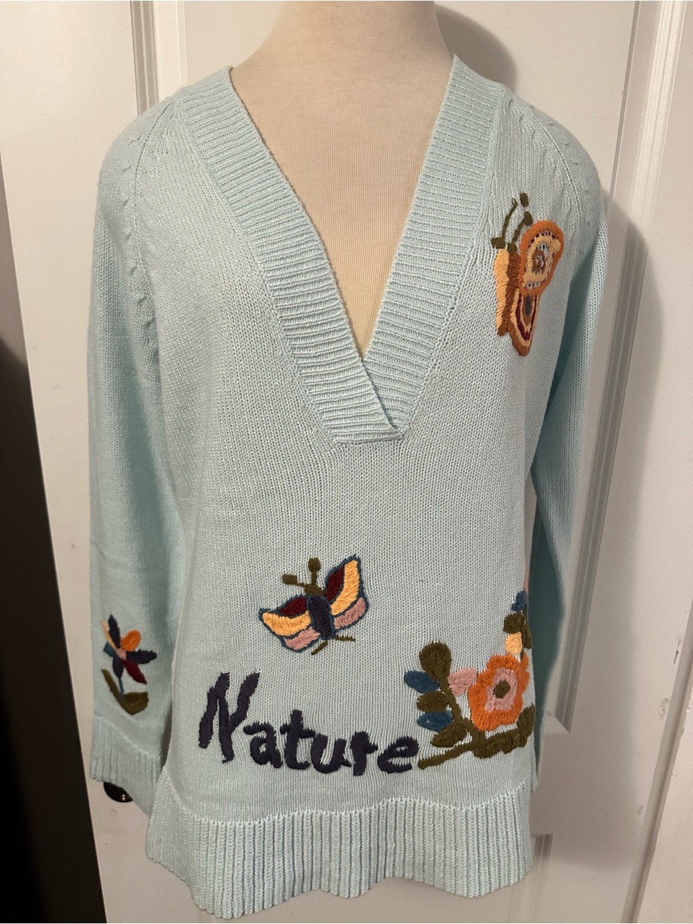 Light Blue V-Neck Sweater with Embroidered Nature Motifs